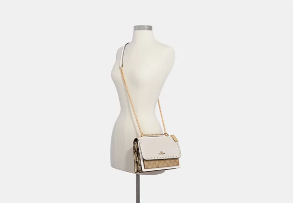Klare Crossbody Bag In Signature Canvas With Rivets