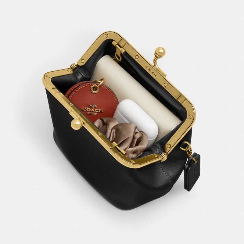 Coach Kisslock bag black pebble leather gold hardware structured 2026