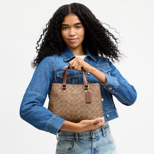 Coach CET31 Station Carryall in Brass/Tan/Brown shown on model