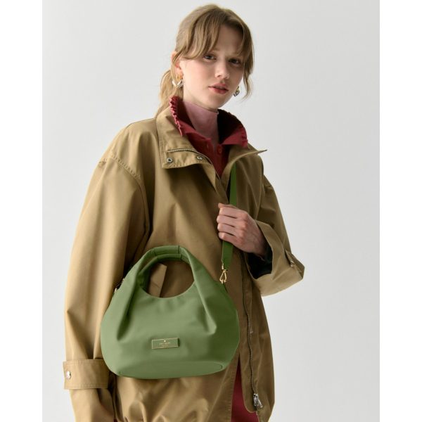 Kate Spade Carter Nylon Small Pleated Crossbody Cedar Stand lifestyle view
