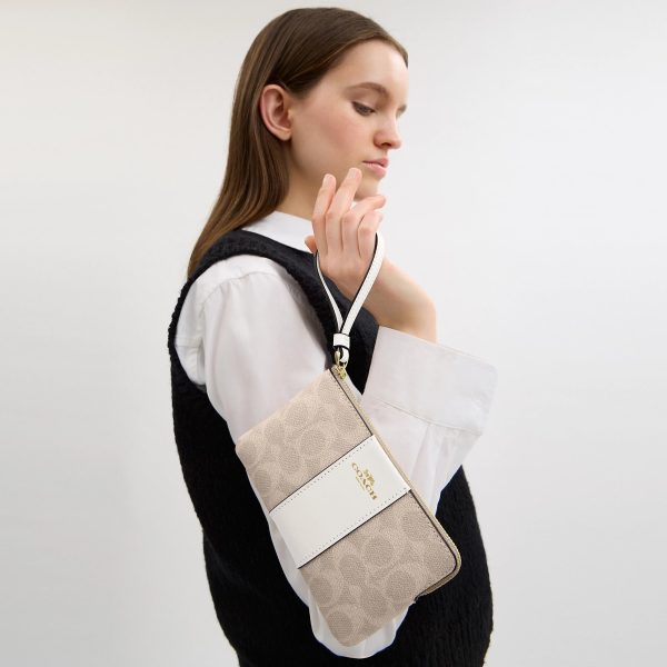 Coach Outlet Corner Zip Wristlet In Signature Canvas With Stripe - Preorder