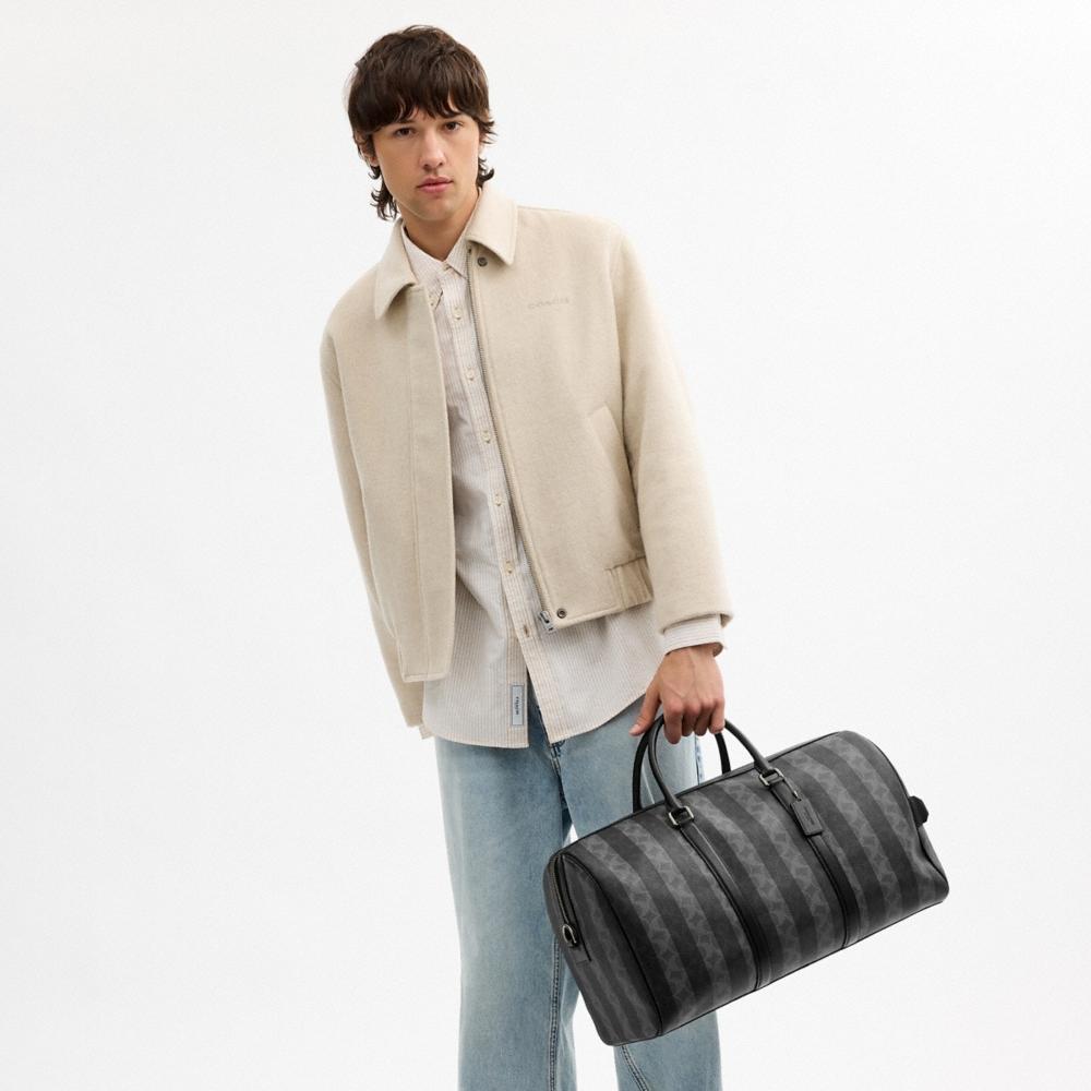 Coach Outlet Venturer Bag In Signature Canvas With Stripes - Preorder