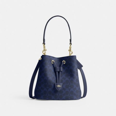 Coach Outlet Rowan Bucket Bag In Signature Canvas - Preorder — Brass/Navy
