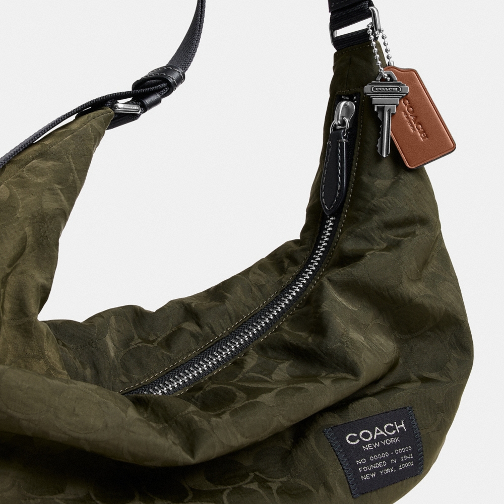 Coach Outlet Leon Sling Bag In Signature Nylon Jacquard - Preorder