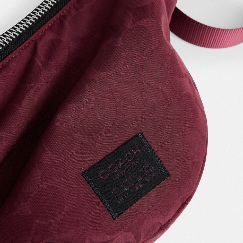 Coach Outlet Leon Sling Bag In Signature Nylon Jacquard - Preorder