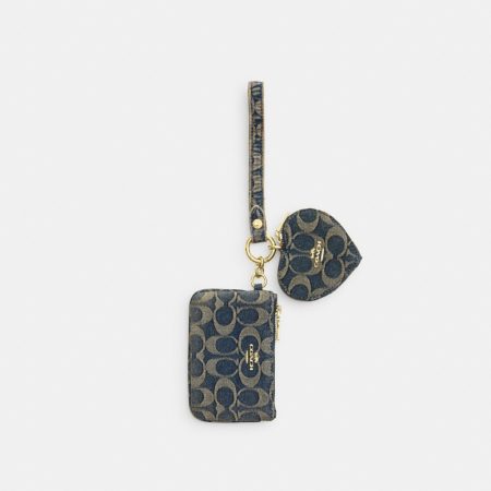 Coach Outlet Wristlet And Heart Pouch In Signature Regenerative Cotton Denim - Preorder — Brass/Denim