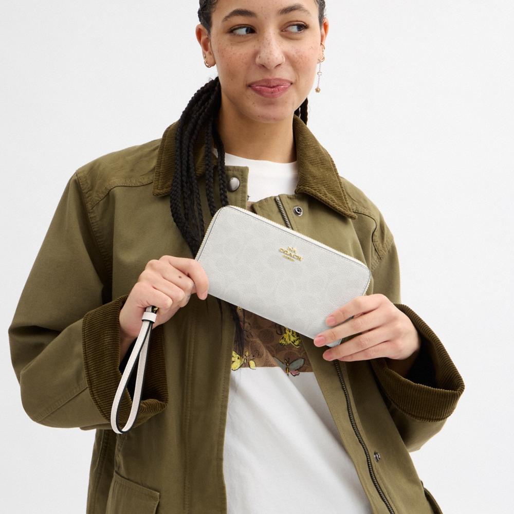Coach Outlet Long Zip Around Wallet In Signature Canvas - Preorder