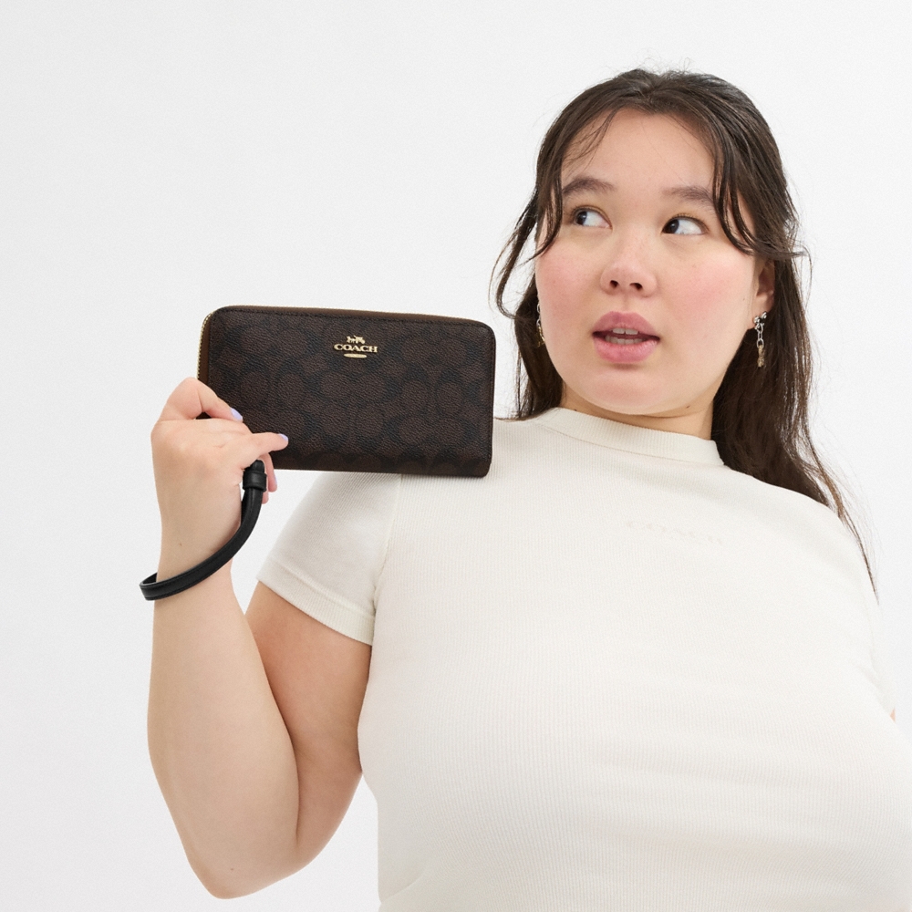 Coach Outlet Long Zip Around Wallet In Signature Canvas - Preorder