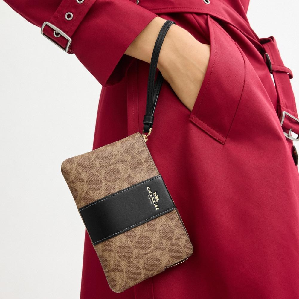 Coach Outlet Corner Zip Wristlet In Signature Canvas With Stripe - Preorder