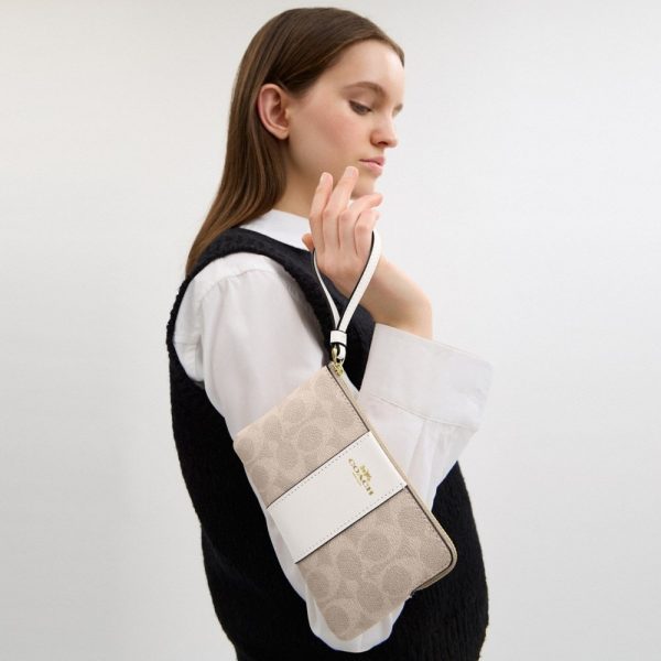 Coach Outlet Corner Zip Wristlet In Signature Canvas With Stripe - Preorder