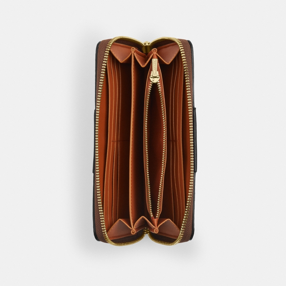 Coach Outlet Long Zip Around Wallet In Signature Canvas With Stripe - Preorder