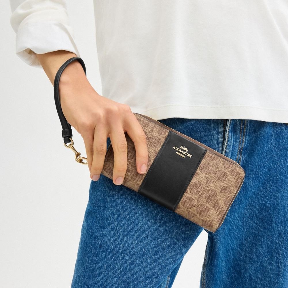 Coach Outlet Long Zip Around Wallet In Signature Canvas With Stripe - Preorder