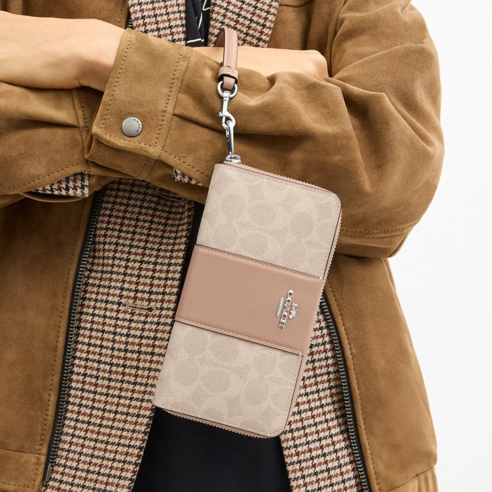 Coach Outlet Long Zip Around Wallet In Signature Canvas With Stripe - Preorder