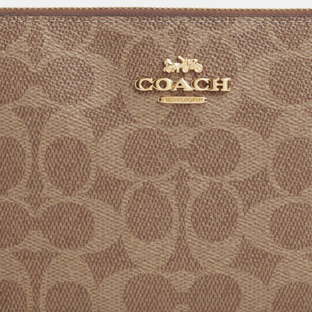 Coach Outlet Large Corner Zip Wristlet In Signature Canvas - Preorder
