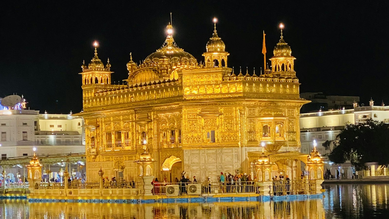 Golden Temple illuminated at night reflected in the sacred pool at Amritsar