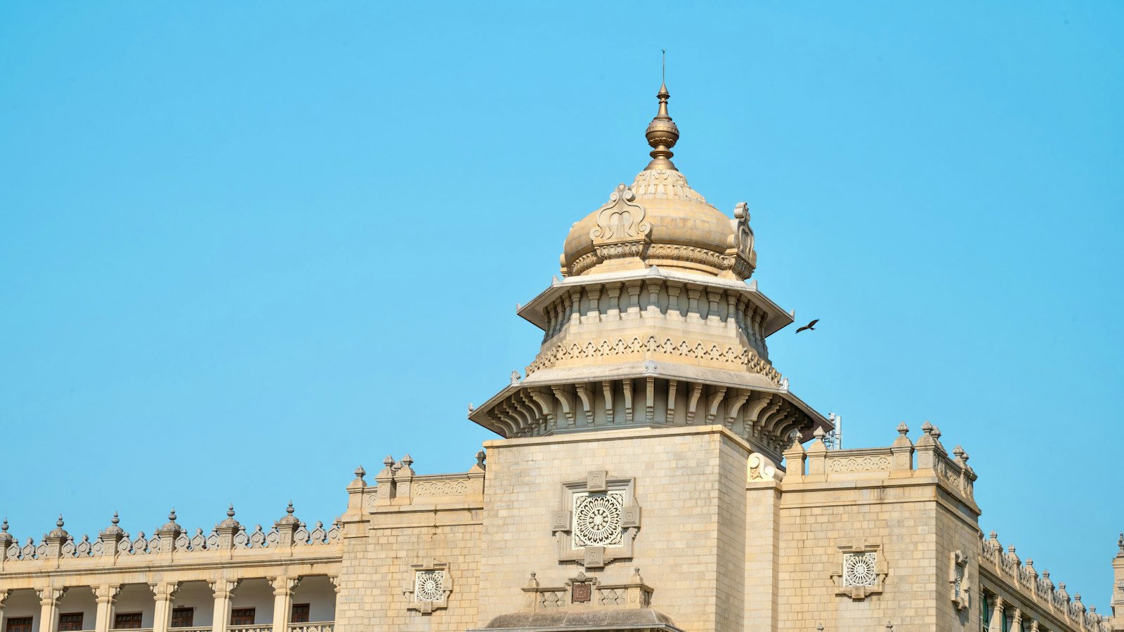 Vidhana Soudha's ornate central dome rising against a clear blue sky in Bengaluru