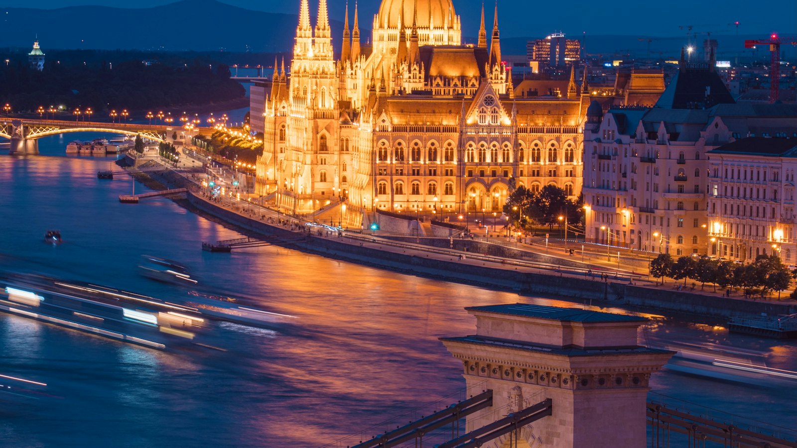 Hungarian Parliament and the Chain Bridge illuminated at blue hour in Budapest