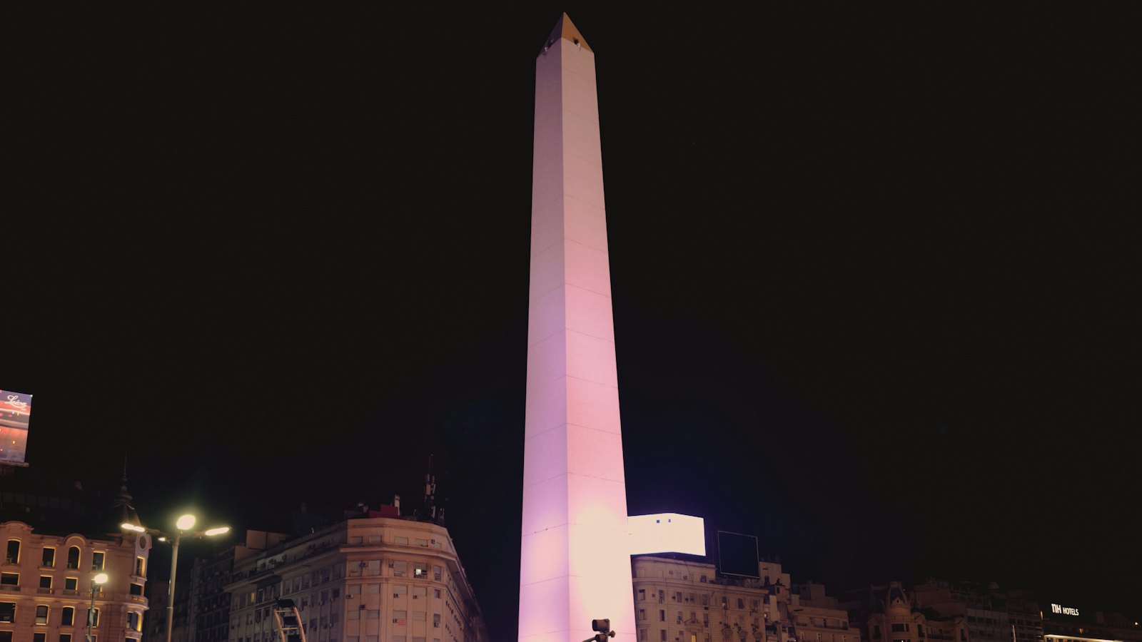 The illuminated Obelisco monument towering over Buenos Aires at night