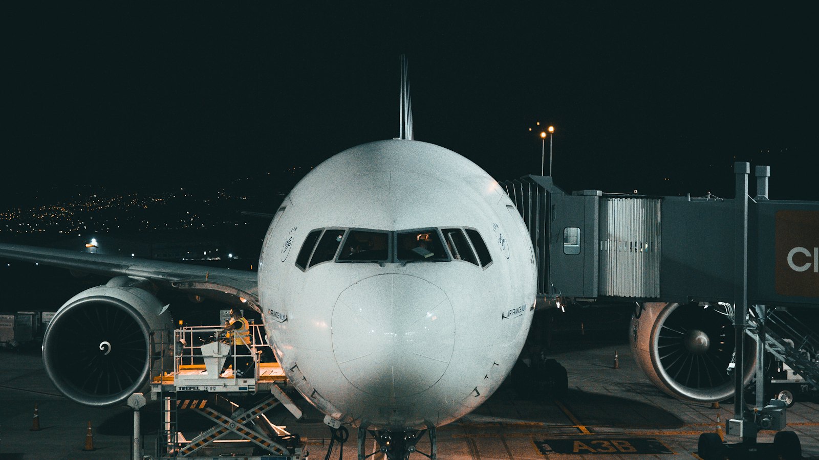 Airliner at the gate at night