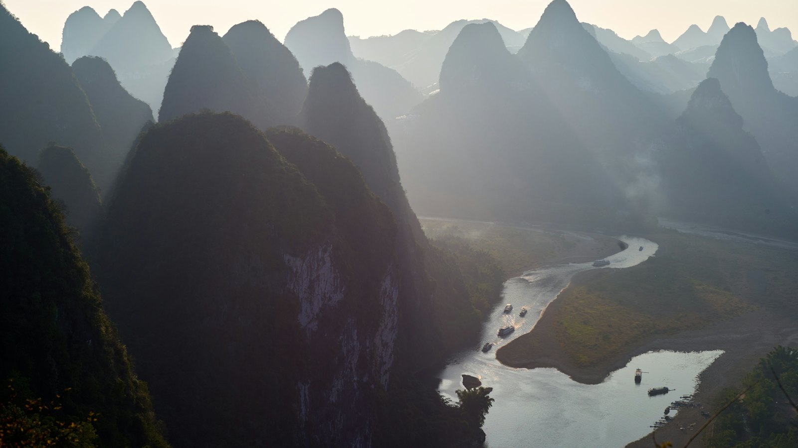 Li River winding between misty karst peaks, seen from Laozhai Hill near Guilin, China