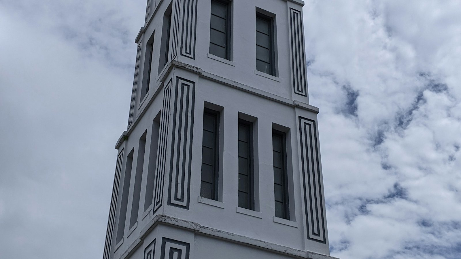 Jam Gadang clock tower with its distinctive Minangkabau roof rising into the sky in Bukittinggi