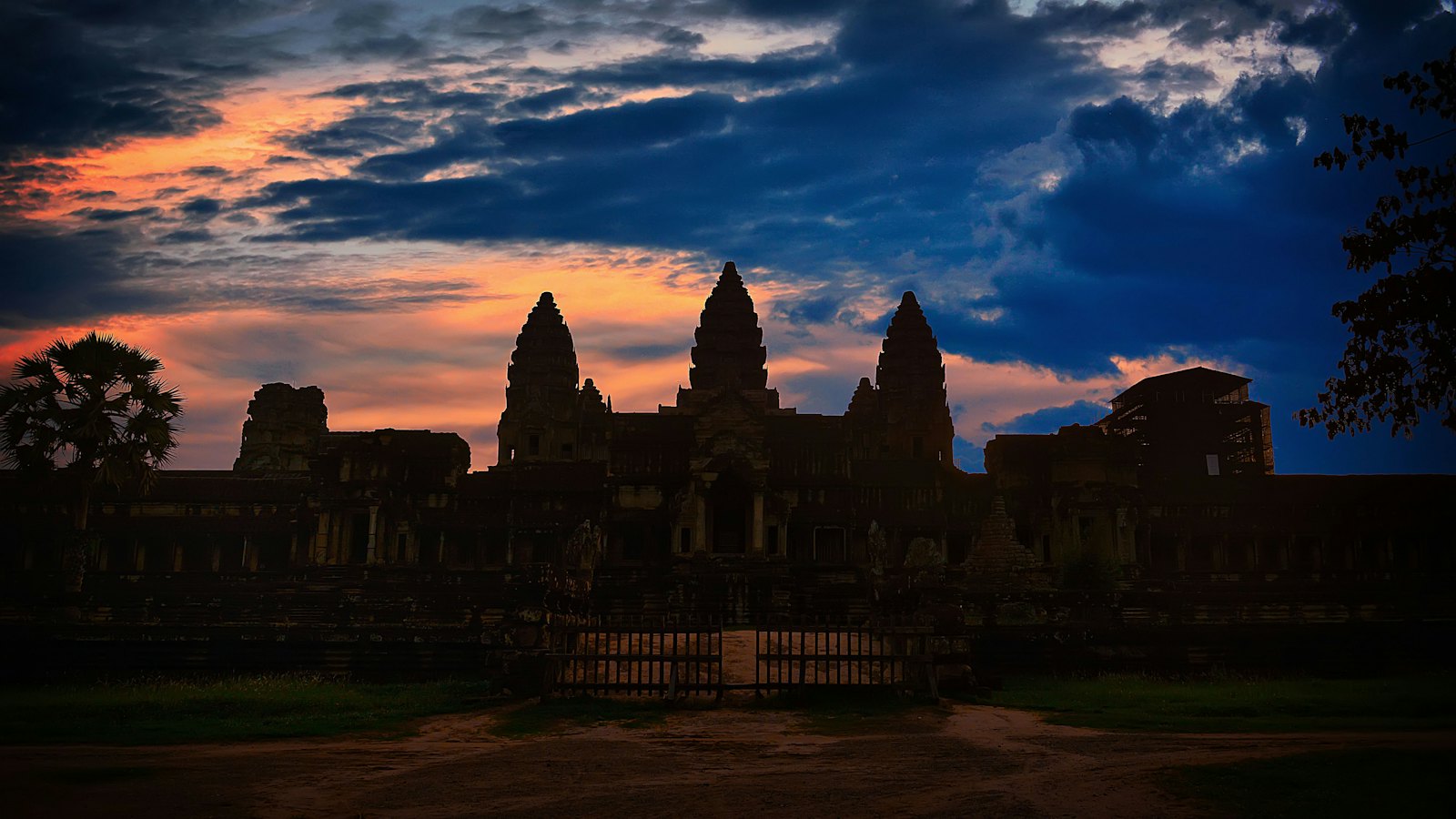 Angkor Wat's lotus-bud towers silhouetted against a stormy blue-hour sky, Siem Reap, Cambodia