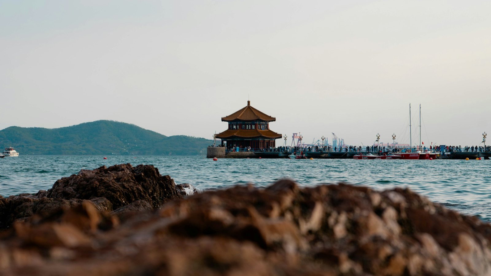 The Huilan Pavilion sits at the end of Qingdao's Zhanqiao Pier at dusk