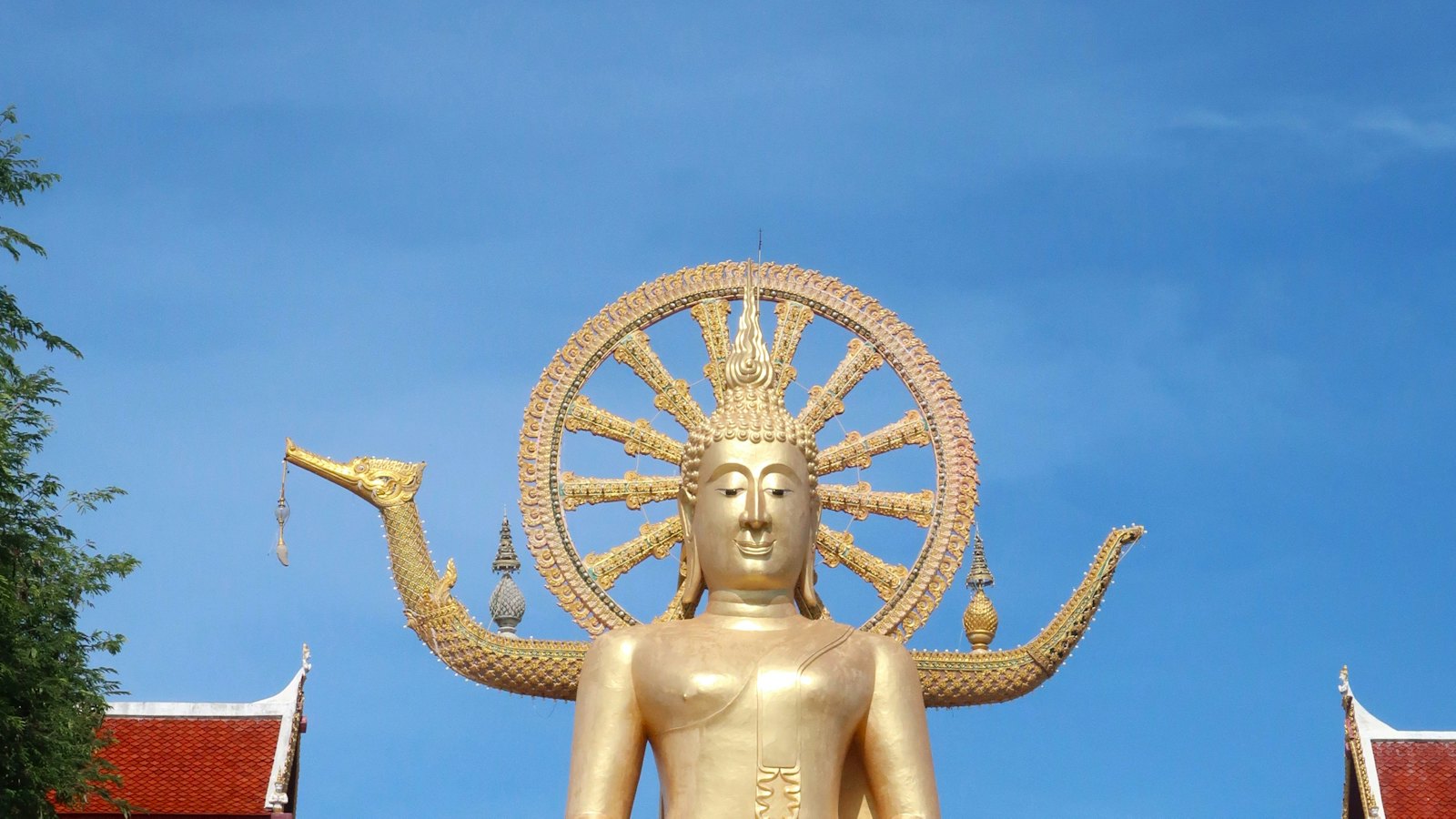 The golden Big Buddha statue towering over Wat Phra Yai in Koh Samui